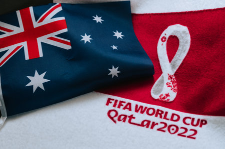 QATAR, DOHA, JULY 18, 2022: Australia National flag and logo of FIFA World Cup in Qatar 2022 on red carpet. Soccer sport background, edit space. Qatar 22 Wallpaper. National symbol, football eventのeditorial素材