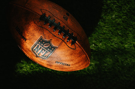 NEW YORK, USA, SEPTEMBER 11, 2023: Detailed View of the NFL Leather Ball on the green field, covered...