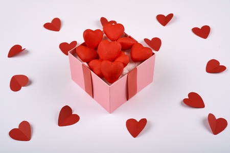 red hearts from paper on a white background around a box of hearts. Valentines day.の写真素材
