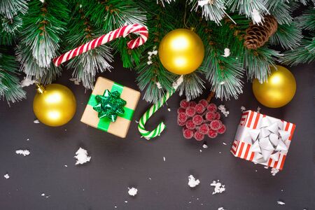 Merry Christmas or Happy New Year frame composition. Fir branches, christmas toys, gift box, fluffy...