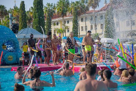 ANTALYA TURKEY 27 SEPT 2019: Party in the pool with foam and show program. Dancing in the summer in...
