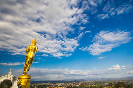 Buddha statue with Thai templeの写真素材