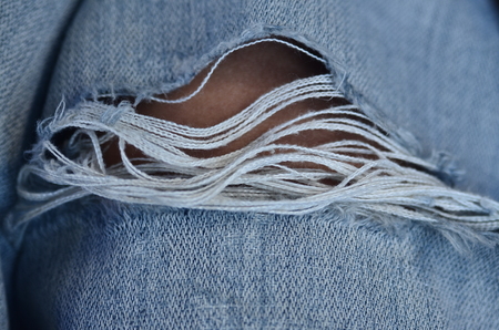 Jeans background texture,Blank real leather jeans label sewed on old worn jeans.の写真素材