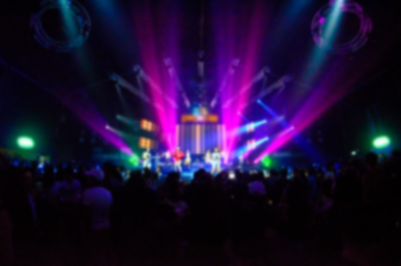 Club Party Blurred For Background,night party festival crowd of people silhouettes hands up with...