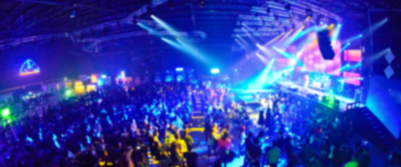 Club Party Blurred For Background,night party festival crowd of people silhouettes hands up with confettiの写真素材