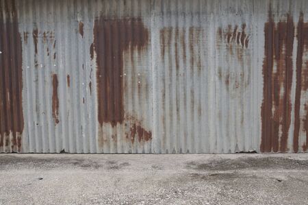 Old zing wall,background of peeling paint and rusty old metal.zinc wall texture pattern background...