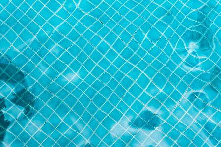 Abstract swimming pool bottom caustics ripple and flow with waves background. Summer background....