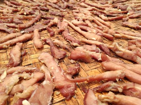 Pork imported pork marinated dried in sun to fry,Homemade dried pork to eat at home in Thailand. Dried pork with sunlight.の写真素材