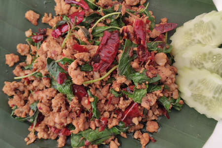 Close up A Thai dish of Basil Fried Rice ,Thai food (Pad Kaprao Moo Kai Dao),の写真素材
