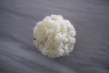 Hand taking some sticky rice at the hungry time. This food style is the culture of the people in northeast of Thailandの写真素材