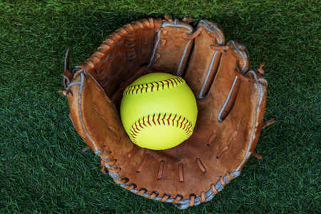 The softball ball in the softball glove has space for text.の写真素材