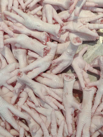 Chicken feet texture close up food background,chicken feet is raw food.verticalの写真素材