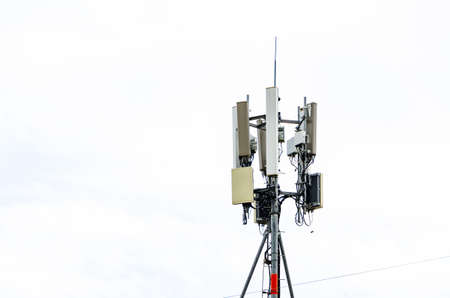 Telecommunication tower of 5G and 5G cellular. Macro Base Station. 6G radio network telecommunication equipment with radio modules and smart antennas mounted on a metalの写真素材
