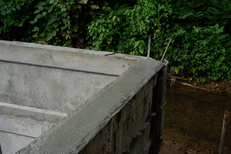 Reinforcement Steel Rebar Cage and Concrete Wall Foundation during Construction. Structural Engineering Detail.の写真素材