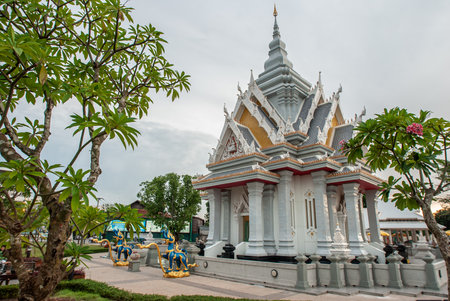 Khon Kaen, Thailand  August 13, 2009 : The Modern Stupa and Golden Kalpapruek Tree at Khon Kaen City Shrine, a Spiritual Landmark in Northeast Thailand, during Dusk.のeditorial素材