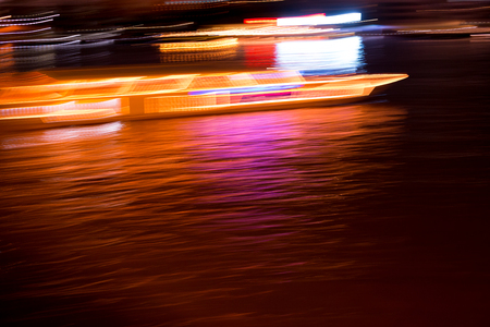 Abstract background of light motion in the river at night,Blurred backgroundの写真素材
