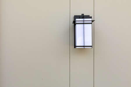 Lamp beside the brick wall style