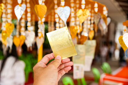 Several golden Pho tree leaves are hanging for decoration. Pho leaf, silver & gold For allusionsの写真素材