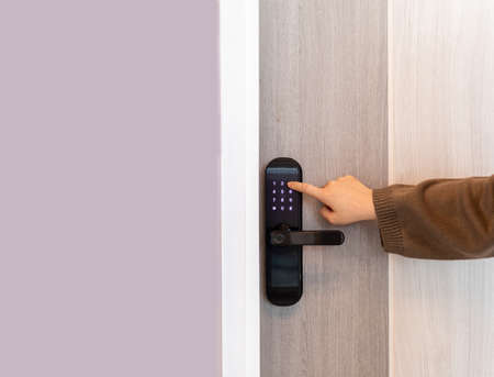 Hand open door digital and access control in a condoの写真素材