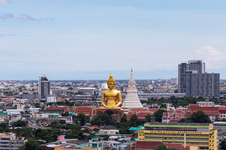 Bangkok, Thailand - 08/17/2020 : Aerial view of the Giant Golden Buddha in Wat Paknam Phasi Charoen Temple in Phasi Charoen district on Chao Phraya River at night, Bangkok. Urban town, Thailand. Downtown City.のeditorial素材