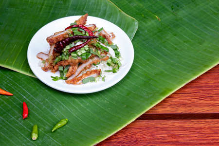 Fried pork with garlic mix herb and spices Thai style food.の写真素材
