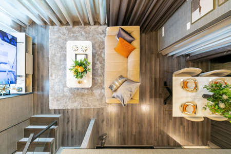 Birds eye view, a scene at local condo where people relax by sitting on couch