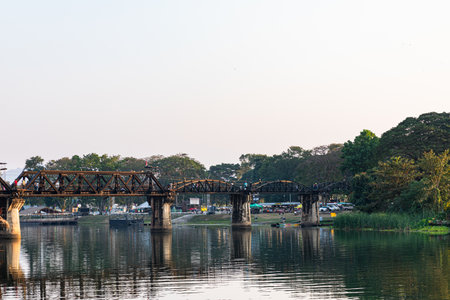 KANCHANABURI, THAILAND - DECEMBER 23, 2021: Tourists on the bridge over the river Kwai (Khwae) in Kanchanaburi, Thailand. This bridge is famous for its history in WW2.のeditorial素材
