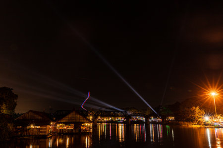 KANCHANABURI, THAILAND - DECEMBER 23, 2021: Tourists on the bridge over the river Kwai (Khwae) in Kanchanaburi, Thailand. This bridge is famous for its history in WW2.のeditorial素材