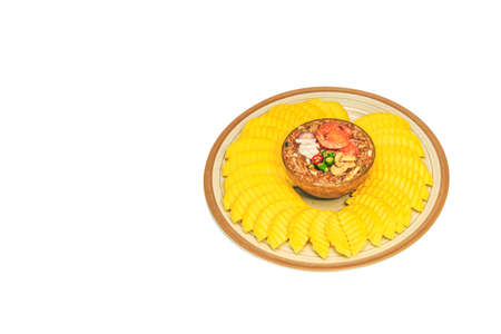Raw green sour mango slice with Thai sweet fish sauce dip.made with coconut sugar put prawn, paprika...