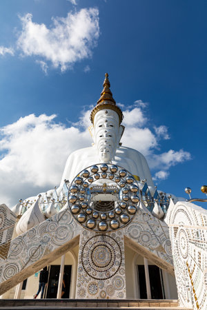 Five big white buddha sculptures with mountain and white cloud with blue sky phasornkaew temple in khao kho Phetchabun Thailand.の写真素材