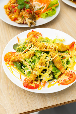 Japanese Cuisine - Tempura Shrimps shrimp in tempura with lemon slices and saladの写真素材
