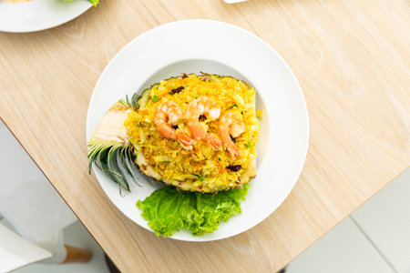 Fried rice with seafood served in a pineapple.の写真素材