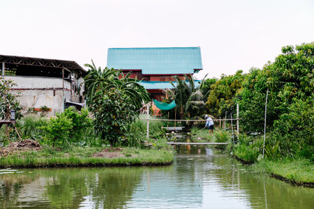Traditional Thai house on the bank of the river.のeditorial素材