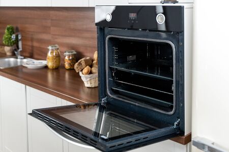 open oven on white rustic kitchen