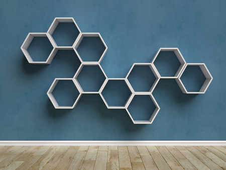 Empty white interior with hexagon shelves on the wallの写真素材