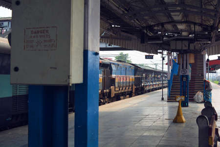 The train on the platform of a railway station.の写真素材