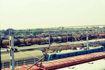 Railway station with freight trains. Industrial background. Toned.