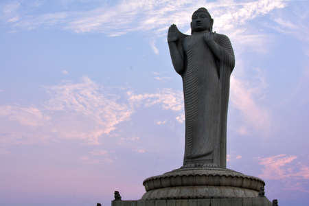 Statue of Guan Yin at sunset in Hong Kong, China.の写真素材