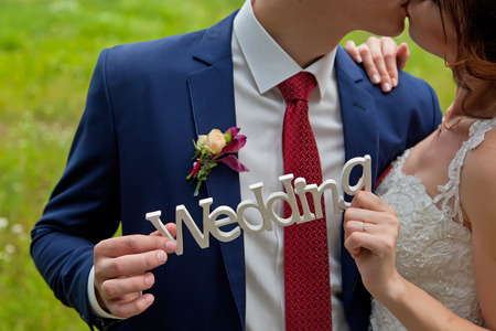 Wedding couple holding wedding plateの写真素材
