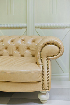 Gold classic sofa in interior. Details backgroundの写真素材