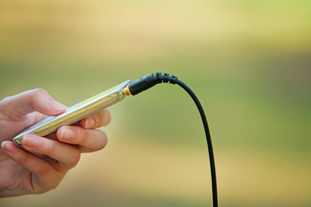 girl holding an mp3 macroの写真素材