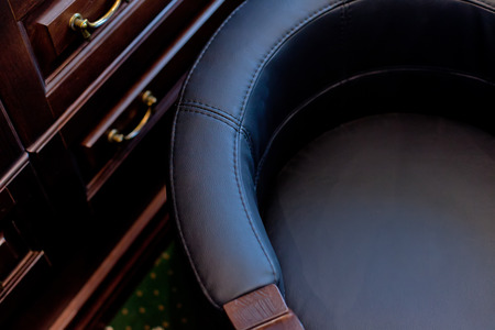 Detail of Old classic wooden chair in chief cabinete. Macroの写真素材