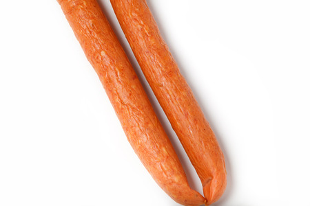 Detail of thin smoked sausages on white background, close upの写真素材
