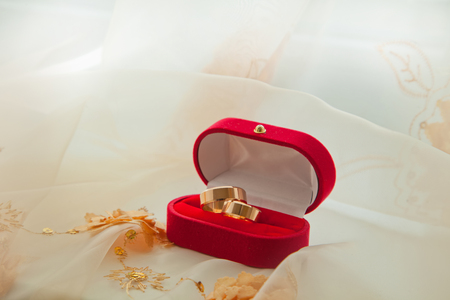 Pair of wedding rings in a gift box backgroundの写真素材