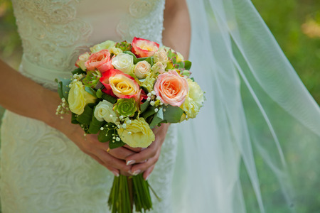 Beautiful wedding flowers in bride handsの写真素材