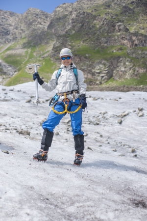 Girl stay on the ice at glacierの写真素材