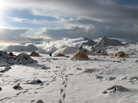 Tents under snow in the camp, Andes.の写真素材