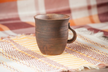 Traditional handcrafted mug on multycolor background. High resolutionの写真素材