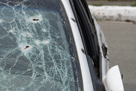 Abstract image of broken glass texture, background. Close-up of a broken car windshield. Broken and damaged carの写真素材