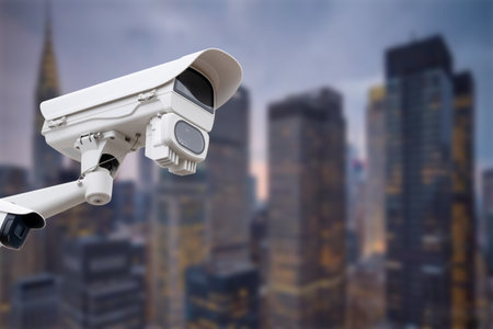 CCTV monitoring, security cameras. Backdrop with views of the city during twilight